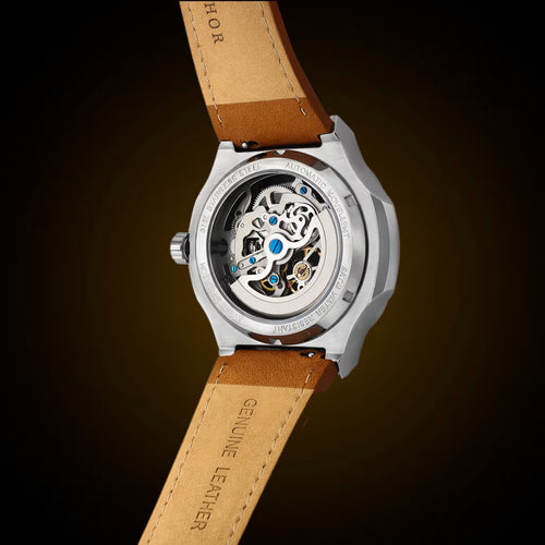 Watch with brown leather strap and visible mechanical components on a dark background